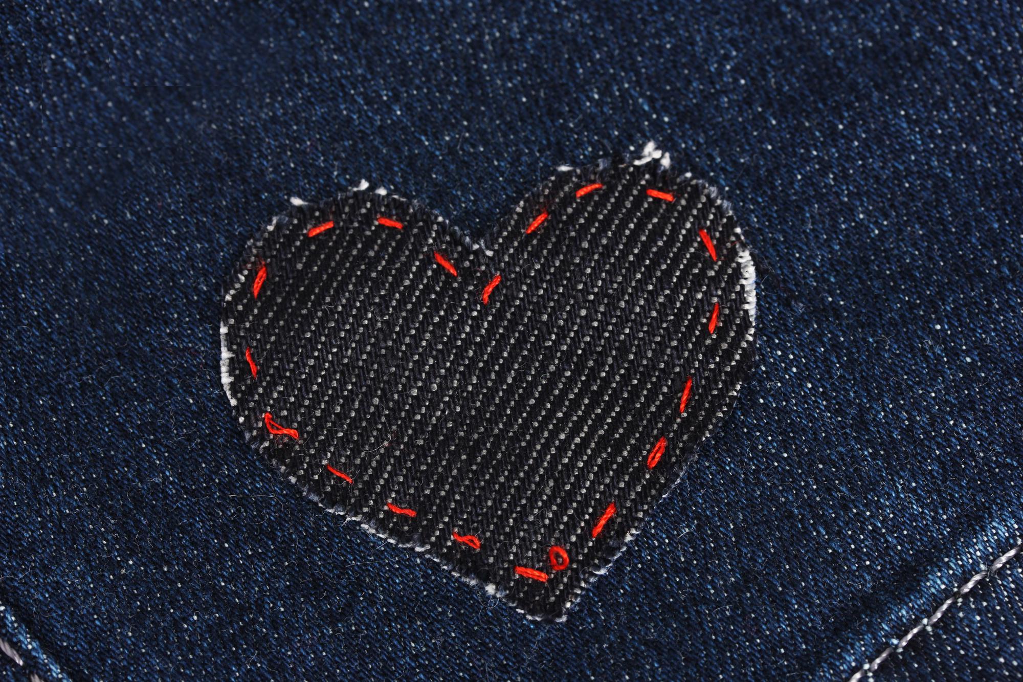 Close-up of modern embroidered patch on denim