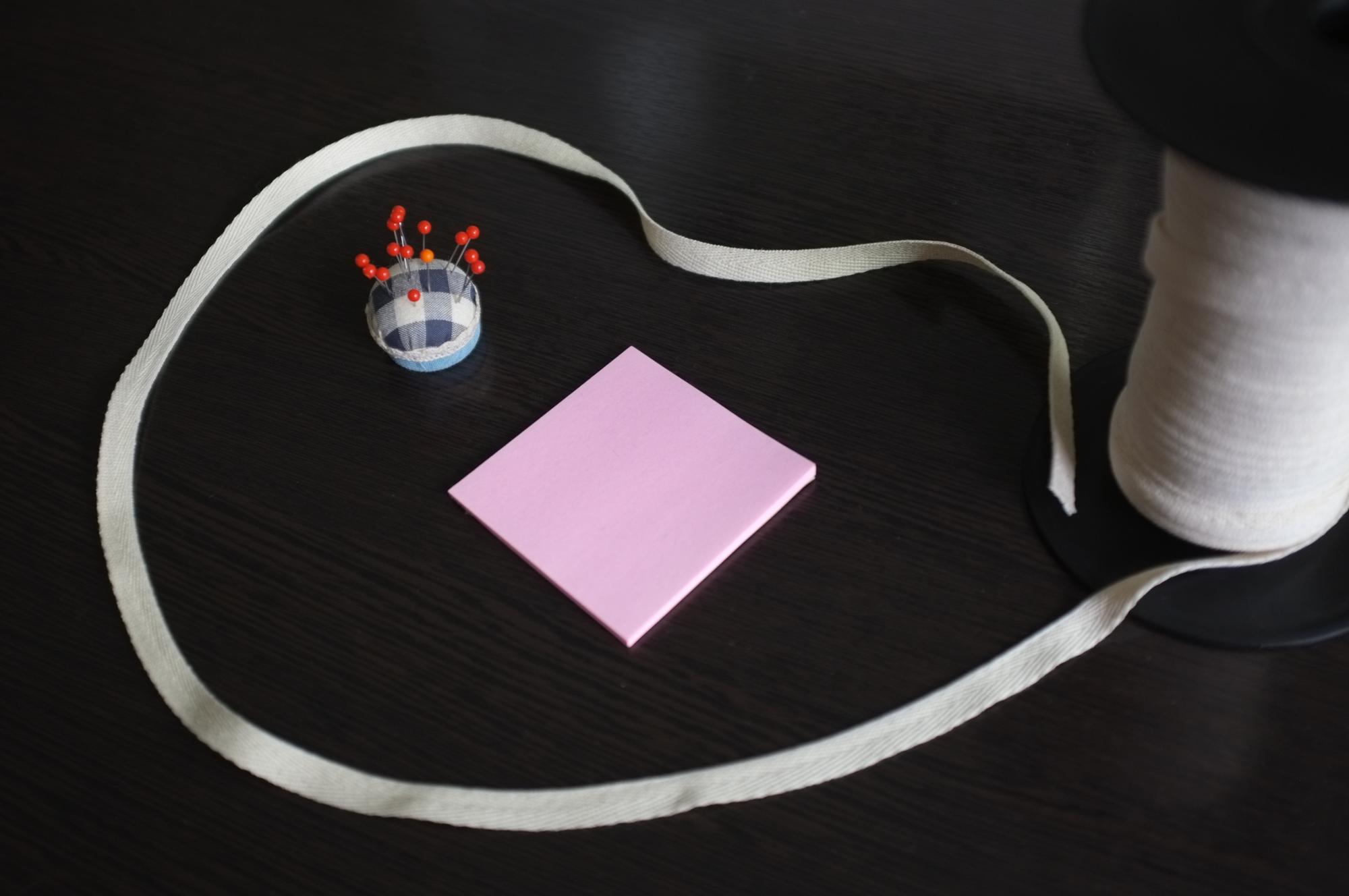 Stack of embroidered patches and thread cards